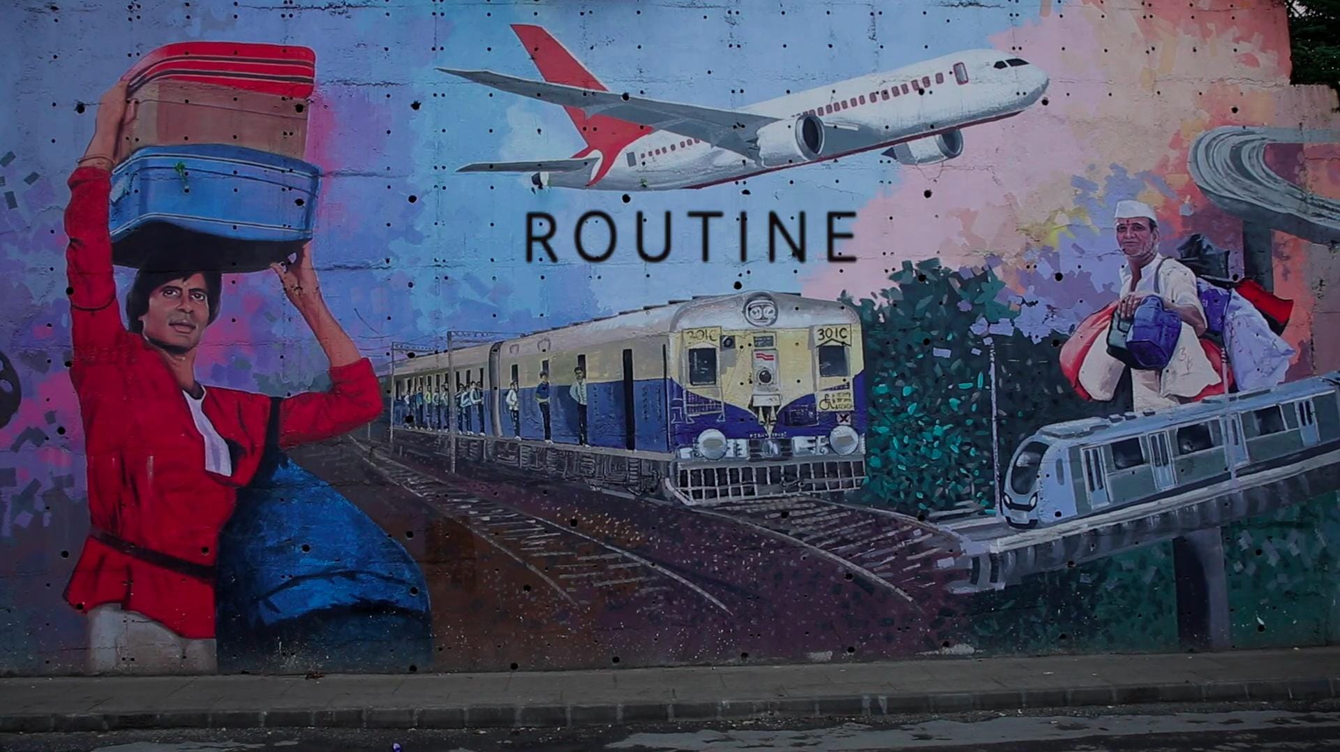 A street mural titled Routine, with a train, a plane, and people carrying luggage